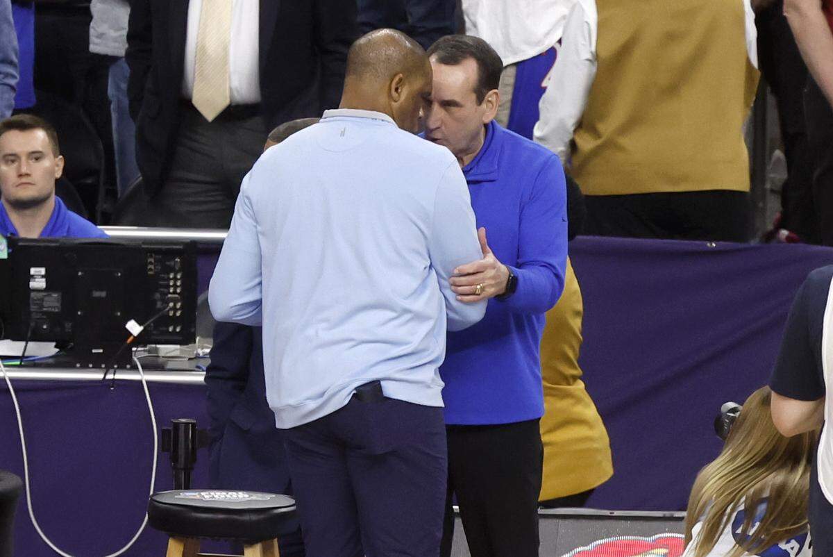 Duke head coach Mike Krzyzewski and North Carolina head coach Hubert Davis greet each other before Duke’s game against UNC in the 2022 Final Four at Caesars Superdome in New Orleans. Under Davis, UNC beat Duke twice in the final month of Krzyzewski’s career.