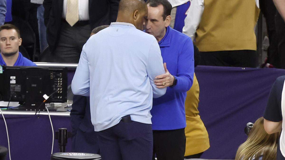 Duke head coach Mike Krzyzewski and North Carolina head coach Hubert Davis greet each other before Duke’s game against UNC in the Final Four at Caesars Superdome in New Orleans, La., Saturday, April 2, 2022.