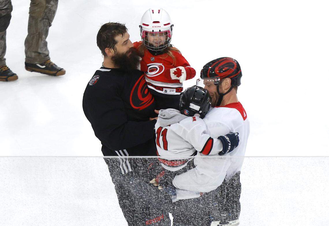 Carolina’s Brent Burns and Jordan Staal skate with their kids after the Carolina Hurricanes practice at Carter-Finley Stadium in Raleigh, N.C., Friday, Feb. 17, 2023.