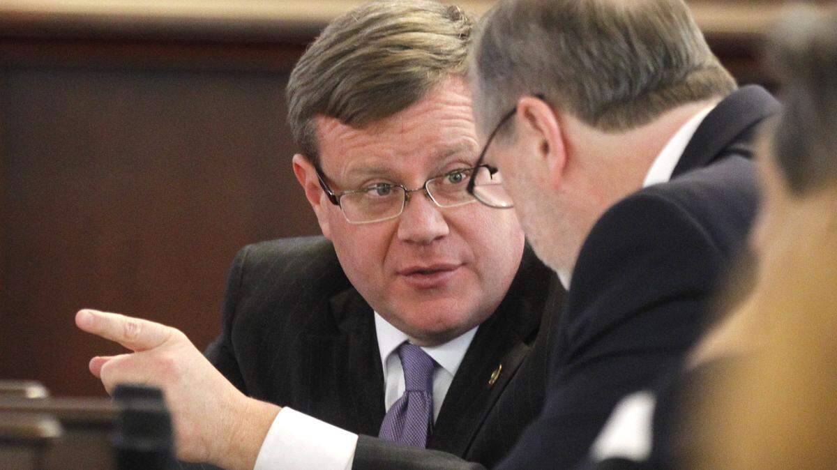 Tim Moore, Speaker of the House, left, confers with Phil Berger, President Pro Tempore, in the Senate chambers during a special session of the N.C. General Assembly at the Legislative Building in 2016.