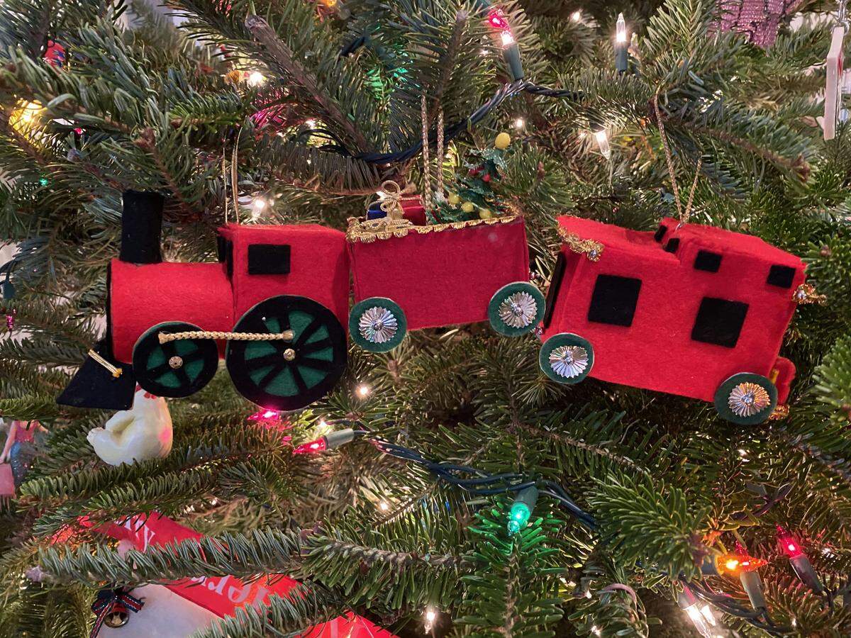A train ornament Jason McDaniel made in 1966, when he was a just-married graduate student at UNC. It’s made a stop on his tree every year since.