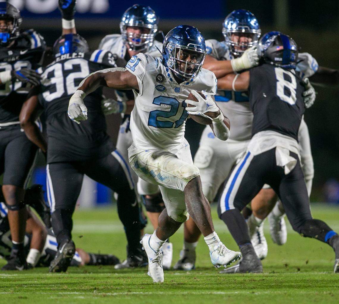 North Carolina’s Elijah Green (21) scores a touchdown on a 20-yard run in the third quarter against Duke on Saturday, October 15, 2022 at Wallace-Wade Stadium in Durham, N.C.