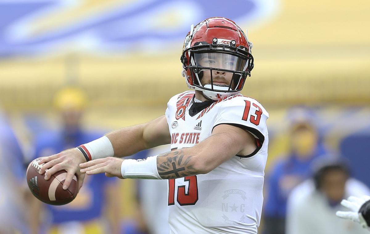 N.C. State’s Devin Leary (13) passes against the Pittsburgh Panthers during the first quarter at Heinz Field.