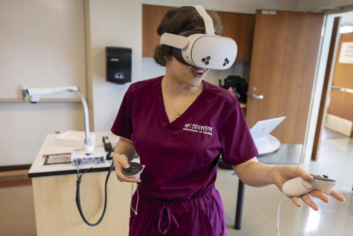 Nursing student Kathryn Chapman uses virtual reality goggles to gain clinical experience in her studies at North Carolina Central University on Tuesday, August 12, 2025, in Durham, N.C.