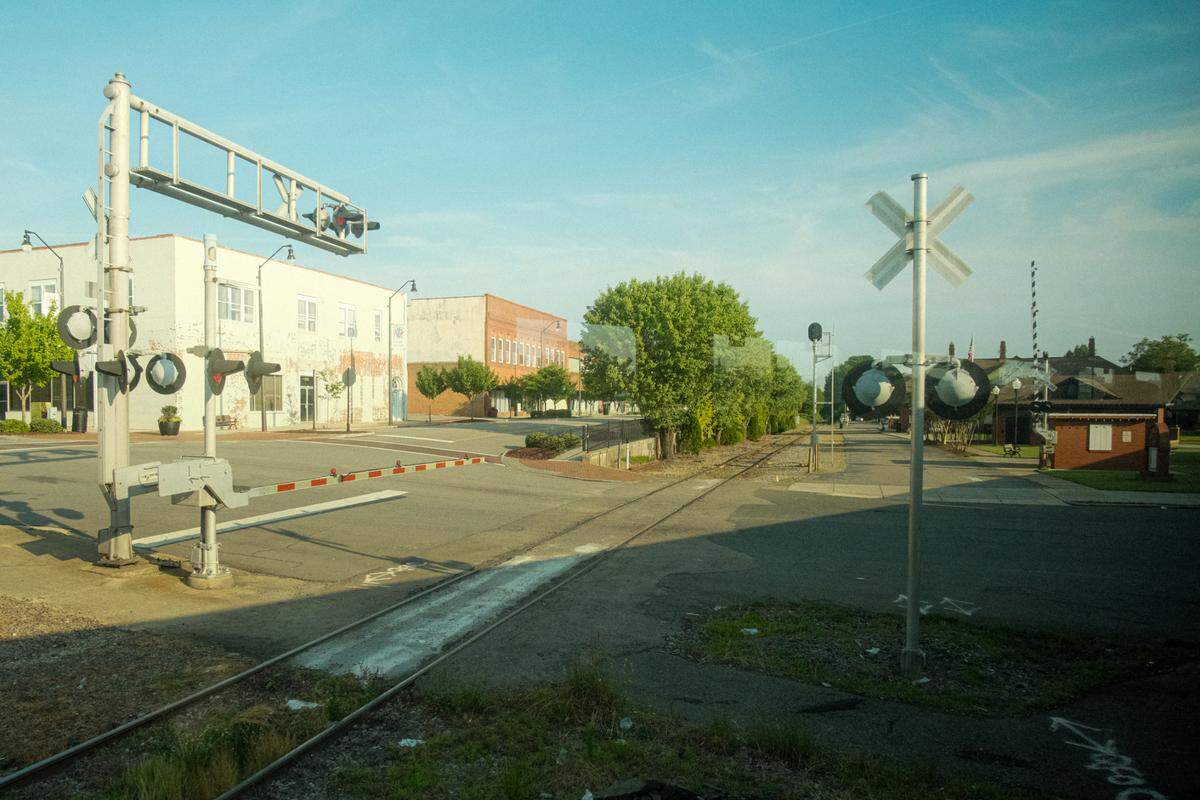 A railroad crossing in Sanford, as seen from a window of the U.S. Open Express. The train is offering daily service from Raleigh to Pinehurst for the U.S. Open.