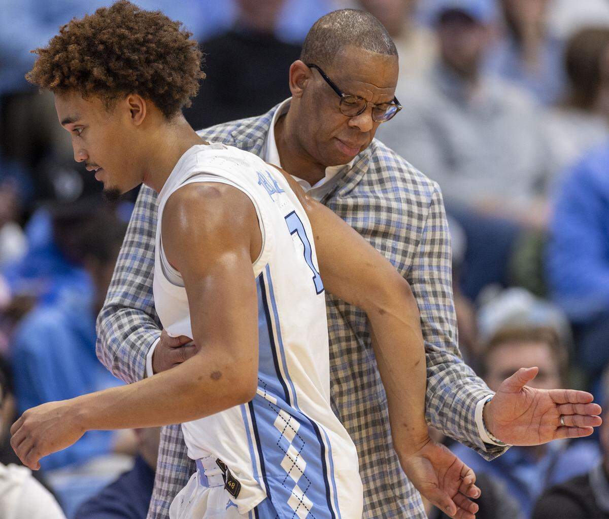 North Carolina coach Hubert Davis gives Seth Trimble (7) a pat in the back as he comes out of the game in the second half against California on Wednesday, January 15, 2025 at the Smith Center in Chapel Hill, N.C.  Trimble scored 12 points in the Tar Heels’ victory. 