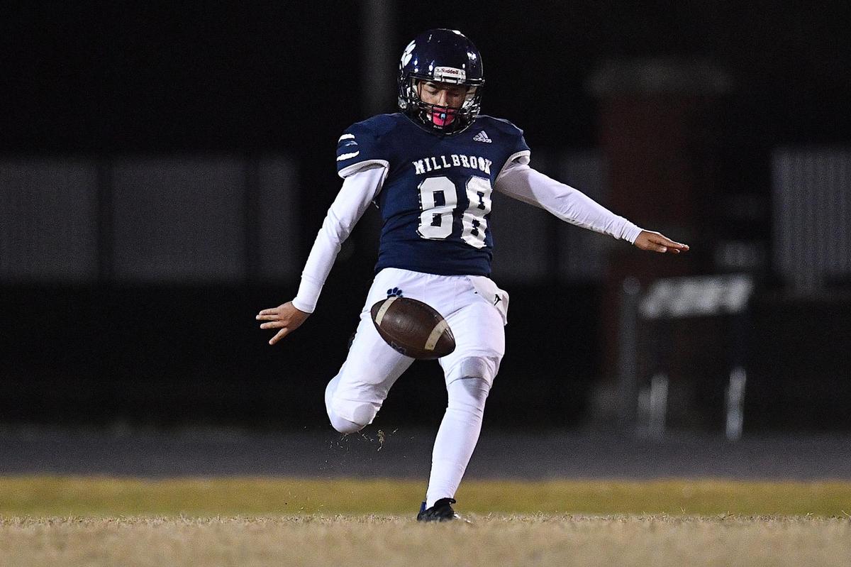 Millbrook kicker Angel Gomez (88) kicks the ball against Heritage in the second half. The Millbrook Wildcats and the Heritage Huskies met in a NCHSAA 4A playoff first round game in Raleigh, N.C. on November 3, 2023.