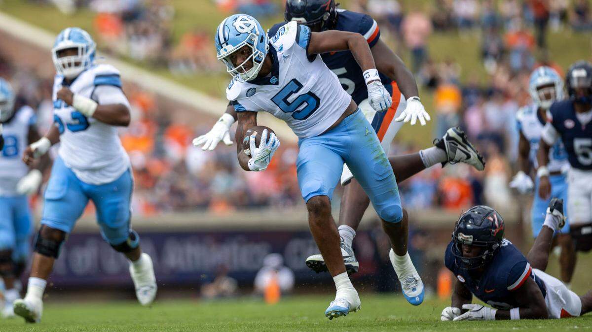 North Carolina wide receiver J.J. Jones (5) scores on a 37-yard pass from Jacolby Criswell to give the Tar Heels’ a 7-3 lead over Virginia in the first quarter on Saturday, October 26, 2024 at Scott Stadium in Charlottesville, Va.