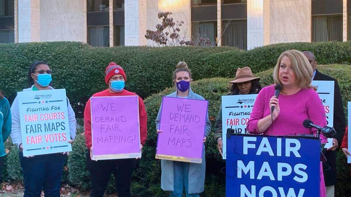 Melissa Price Kromm, right, with North Carolina Voters for Clean Elections speaks at a news conference criticizing the General Assembly’s redistricting process on Nov. 3, 2021 at the Legislative Building in Raleigh.