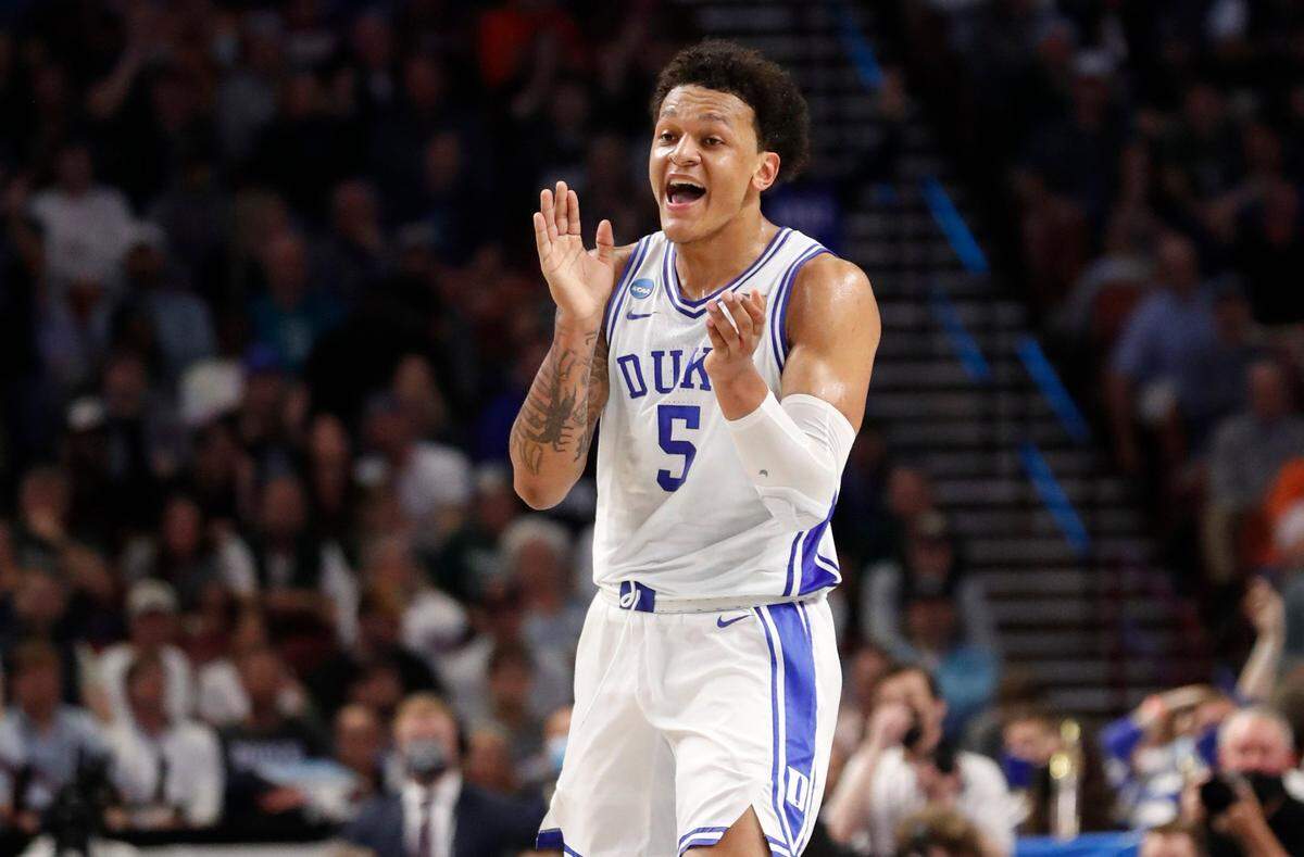 Dukes Paolo Banchero (5) celebrates after hitting a three-pointer during the first half of Dukes game against Michigan State in the second round of the NCAA Tournament at Bon Secours Wellness Arena in Greenville, S.C., Sunday, March 20, 2022.