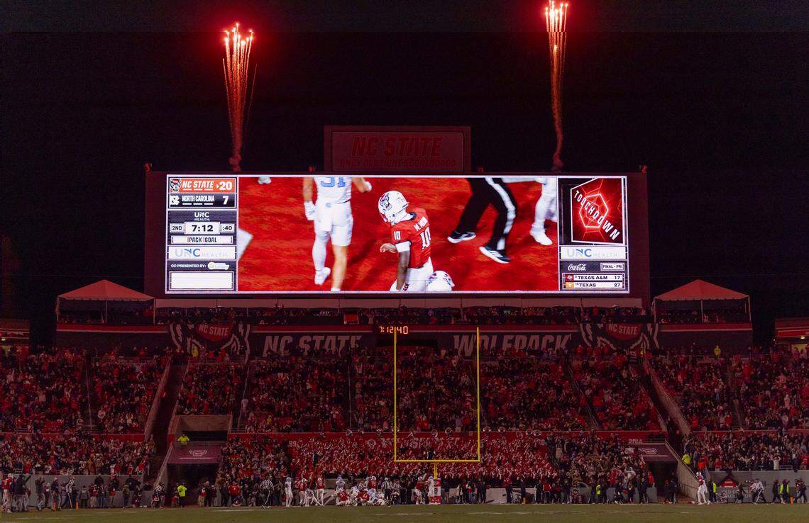 Fireworks illuminate the sky after a touchdown by N.C. State’s Will Wilson to take a 20-7 lead over North Carolina on Saturday, November 29, 2025 at Carter-Finley Stadium in Raleigh, N.C.