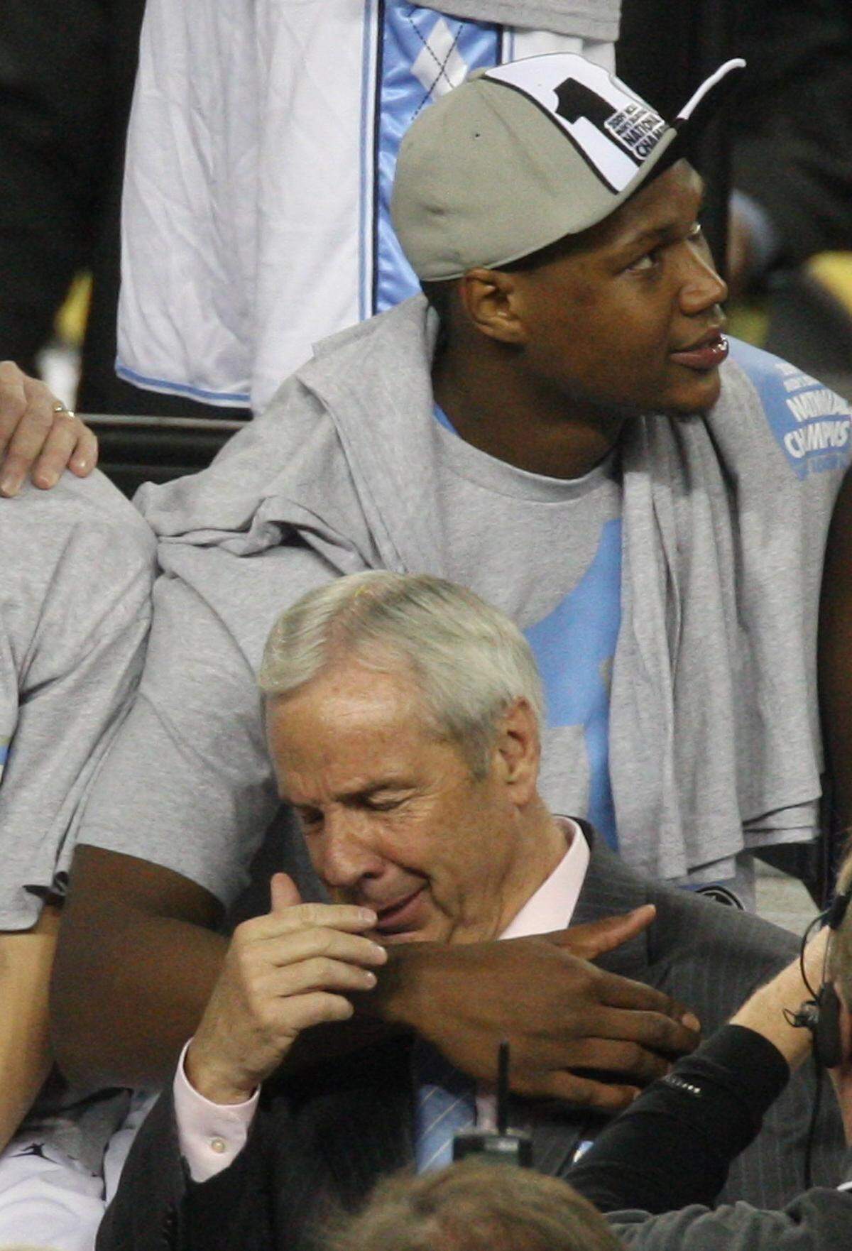 North Carolina’s Deon Thompson (21) holds head coach Roy Williams as he breaks down during the showing of a video recapping the Heels championship run at Ford Field in Detroit, Michigan  Monday April 6, 2009.
