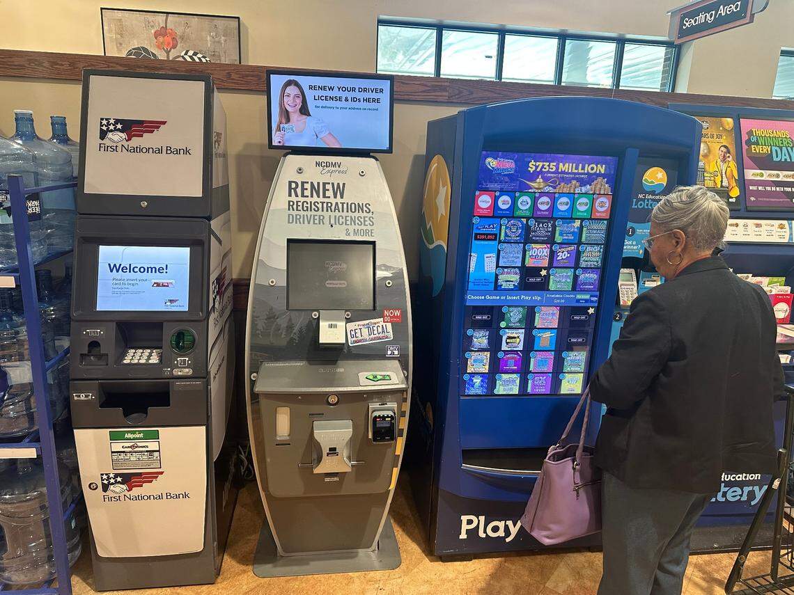 One of three computer kiosks that the N.C. Division of Motor Vehicles has rolled out statewide so far. This one, between an ATM and a lottery ticket machine, is at the Harris Teeter in the Brier Creek area of Raleigh.