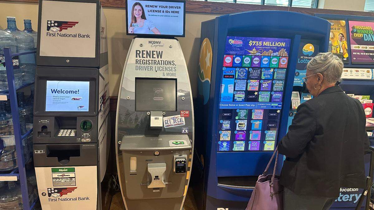 One of three computer kiosks that the N.C. Division of Motor Vehicles has rolled out statewide so far. This one, between an ATM and a lottery ticket machine, is at the Harris Teeter in the Brier Creek area of Raleigh.