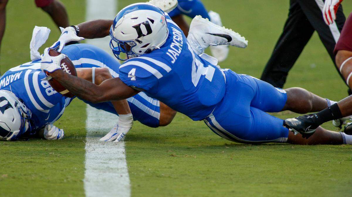Duke Blue Devils running back Deon Jackson (4) dives for a touchdown against the Virginia Tech Hokies in the second half at Wallace Wade Stadium. The Virginia Tech Hokies won 38-31.