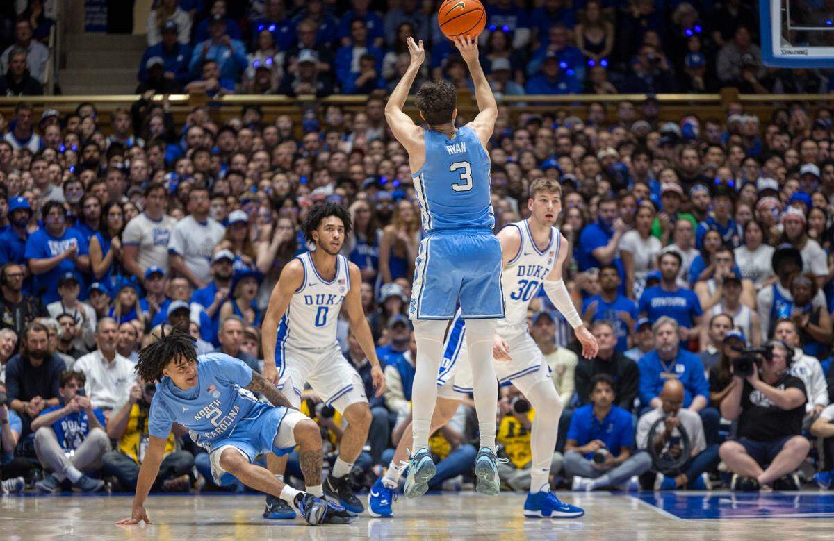 North Carolina’s Cormac Ryan (3) hits his third straight three-point basket in the first half to give the Tar Heels’ a 15-4 lead over Duke on Saturday, March 9, 2024 at Cameron Indoor Stadium in Durham, N.C.