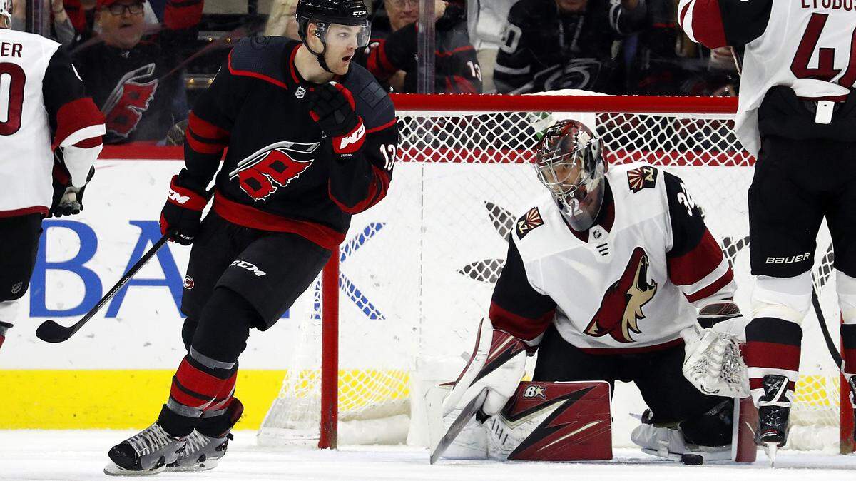 Carolina Hurricanes’ Warren Foegele (13) celebrates his goal on Arizona Coyotes goaltender Antti Raanta (32), of Finland, during the first period of an NHL hockey game in Raleigh, N.C., Friday, Jan. 10, 2020.