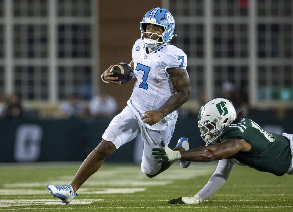 North Carolina quarterback Gio Lopez (7) breaks away from UNC Charlotte defensive lineman Jorel Liverpool (10) for a nine yard gain in the second quarter on Saturday, September 6, 2025 at Jerry Richardson Stadium in Charlotte, N.C. 
