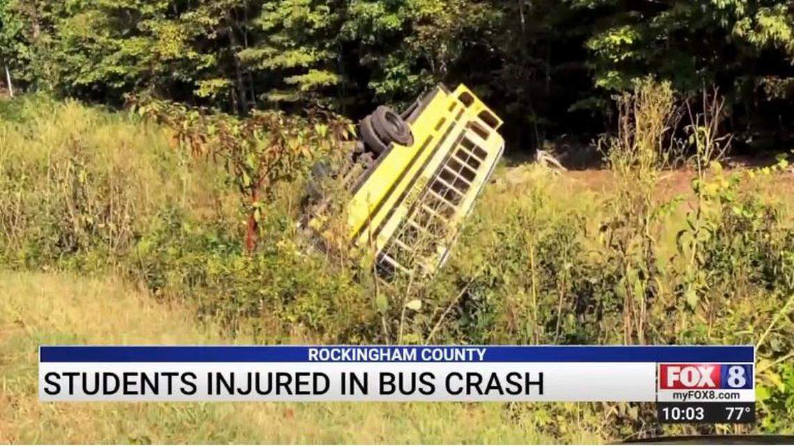 A school bus overturned after a driver crashed into it head-on, North Carolina officials say.