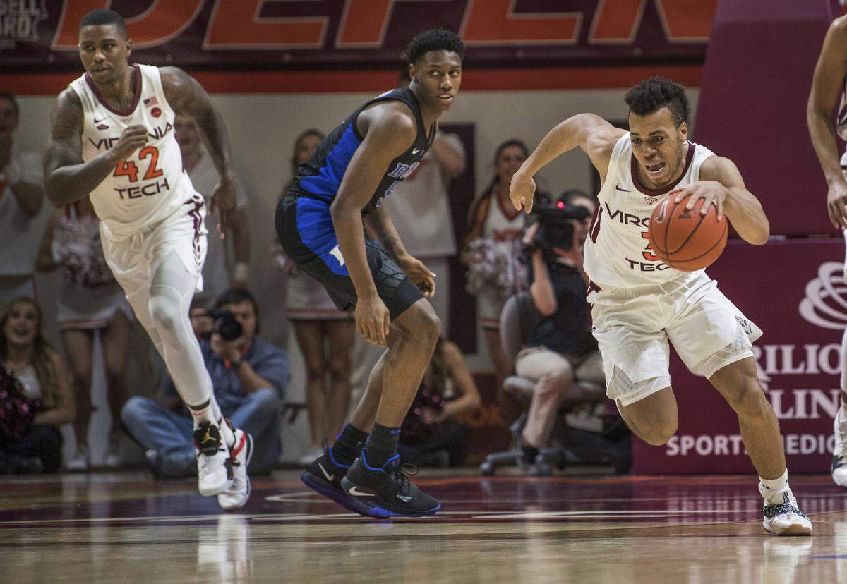 Virginia Tech guard Wabissa Bede (3) starts a fast break near Duke forward RG Barrett during the second half of an NCAA college basketball game in Blacksburg, Va., Tuesday, Feb. 26, 2019.