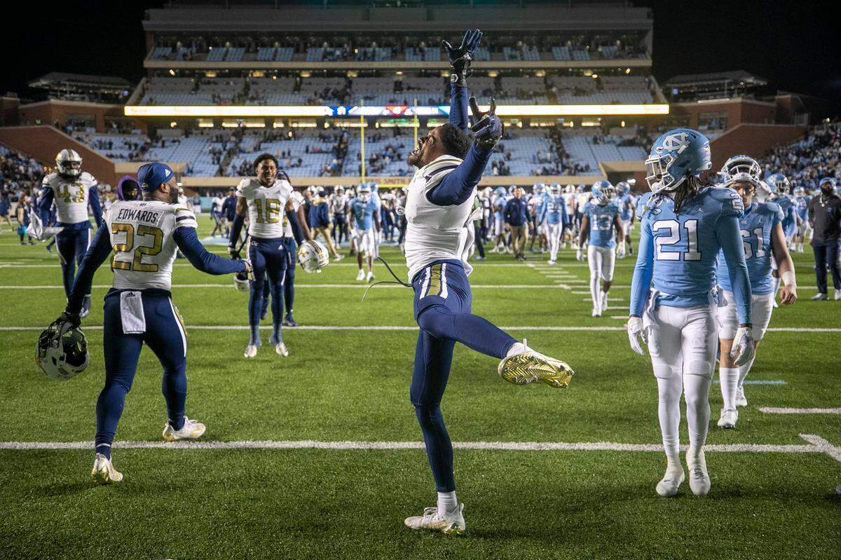 Georgia Tech’s Myles Sims (0) celebrates the Yellowjackets’ 21-17 victory over North Carolina on Saturday, November 19, 2022 at Kenan Stadium in Chapel Hill, N.C.