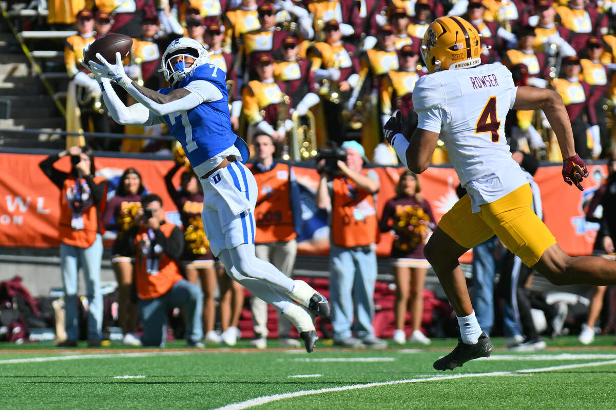 Duke wide receiver Que'Sean Brown of the Duke Blue Devils catches a pass against defensive back Myles "Ghost" Rowser of the Arizona State Sun Devils during the first half of the Tony The Tiger Sun Bowl game at Sun Bowl Stadium on Dec. 31, 2025 in El Paso, Texas.