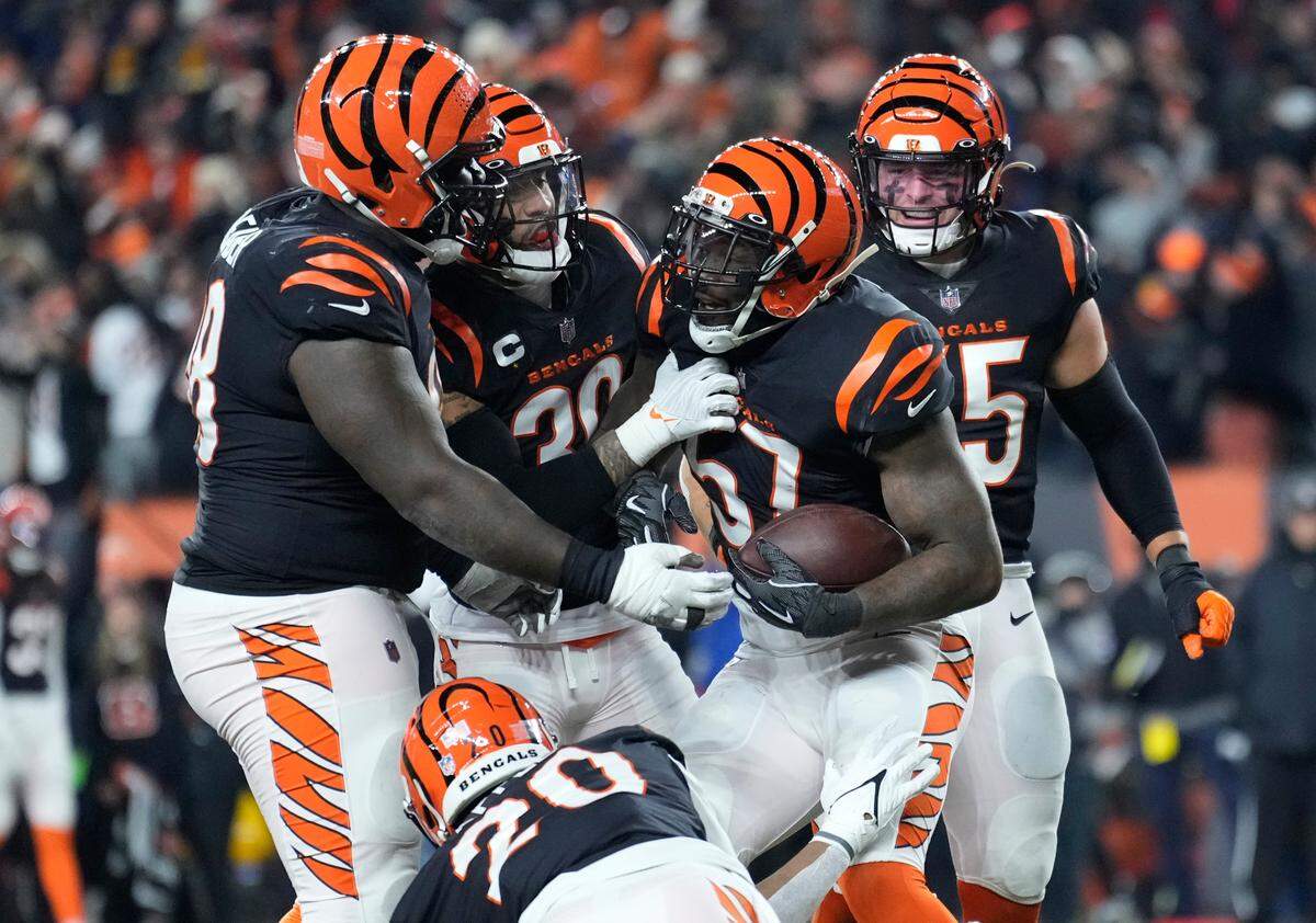Cincinnati Bengals’ Germaine Pratt (57) celebrates with teammates after intercepting a pass during the second half of an NFL wild-card playoff football game against the Las Vegas Raiders, Saturday, Jan. 15, 2022, in Cincinnati. Cincinnati won 26-19.