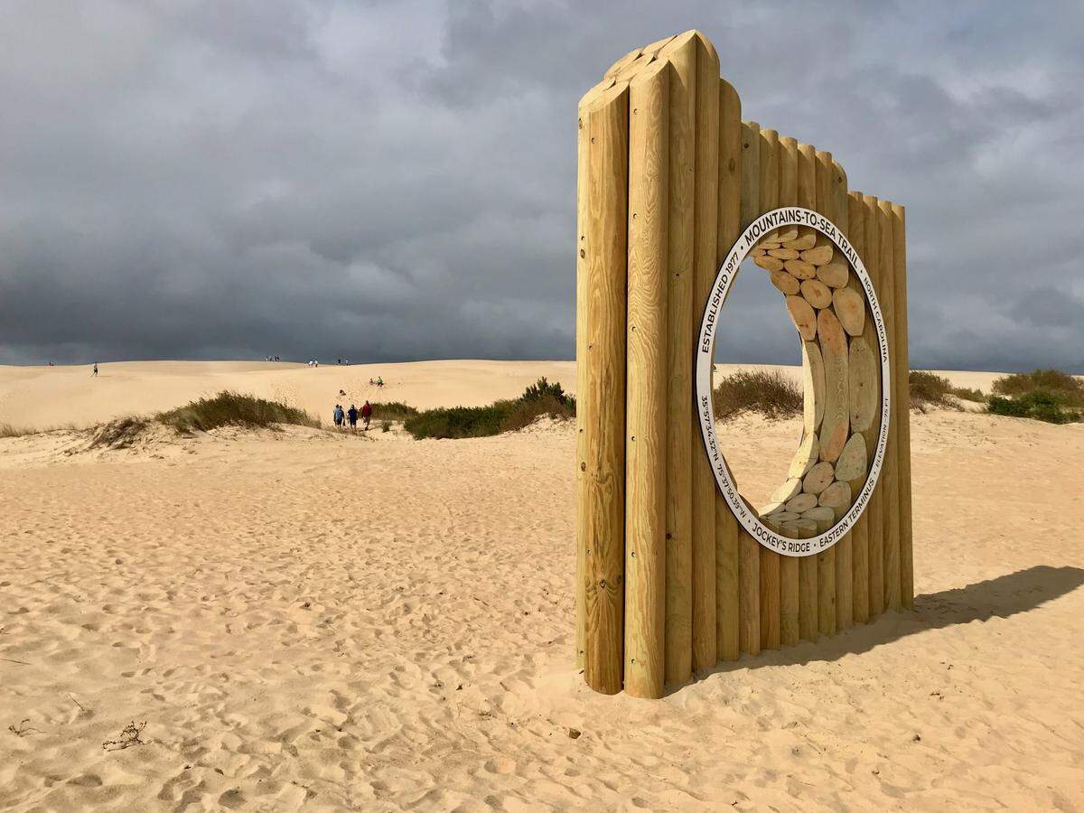 A monument marking the beginning and the end of the Mountains-to-Sea Trail was unveiled in Jockey’s Ridge State Park in Nags Head, NC, on Sept. 29, 2023. The trail runs 1,175 miles from the park to Great Smoky Mountains National Park.