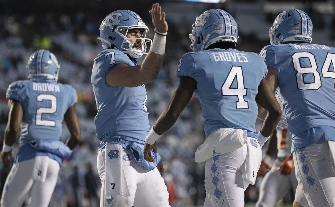 North Carolina quarterback Sam Howell (7) congratulates Toe Groves (4) after a pass reception in the second quarter against Mercer on Saturday, November 23, 2019 at Kenan Stadium in Chapel Hill, N.C.