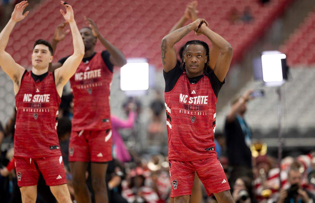 N.C. State’s D.J. Horne (0) and his teammates stretch during their open practice on Friday, April 5, 2024, as they prepare for their NCAA National Semi-Final game against Purdue at State Farm Stadium in Glendale, AZ.