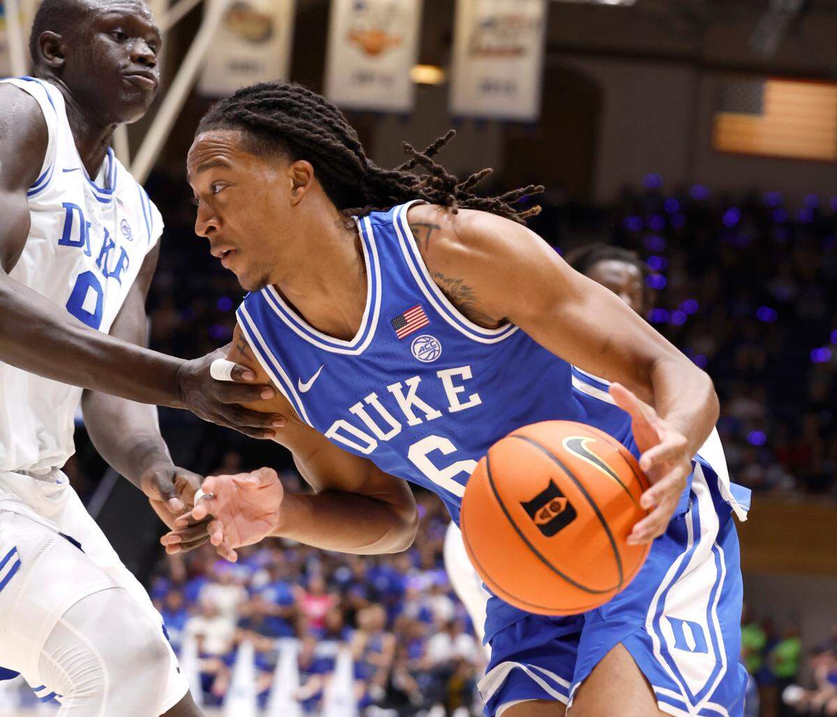 Duke’s Maliq Brown (6) drives by Khaman Maluach (9) during a scrimmage during the Blue Devils’ Countdown to Craziness at Cameron Indoor Stadium in Durham, N.C., Friday, Oct. 4, 2024.
