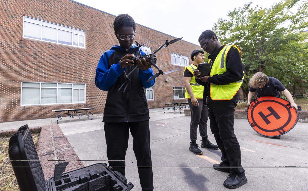 Students prepare to fly a drone during a drone technology elective class at East Wake High School in Wendell on Wednesday, May 6, 2026.
