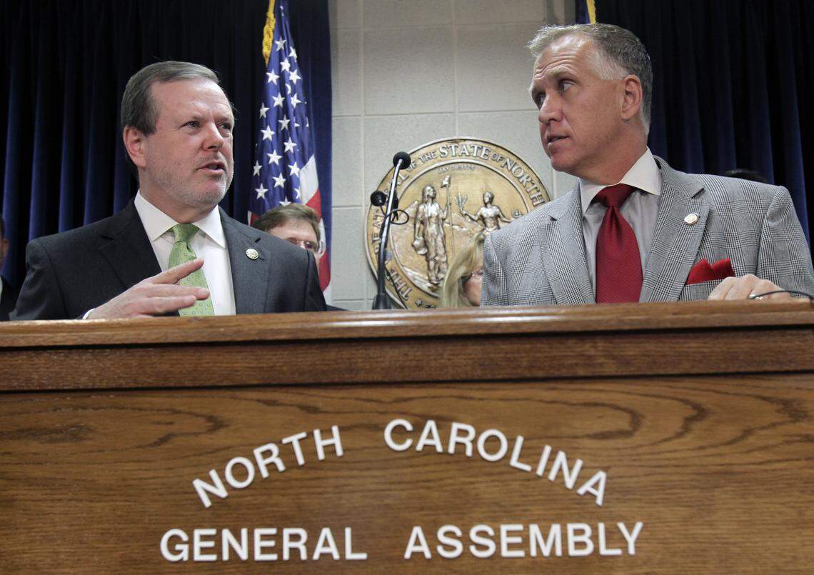 N.C. Senate Pro-Tem Phil Berger, left, responds to a question while N.C. House Speaker Thom Tillis listens at a joint budget press conference held at the Legislative Building in Raleigh in June 2012.