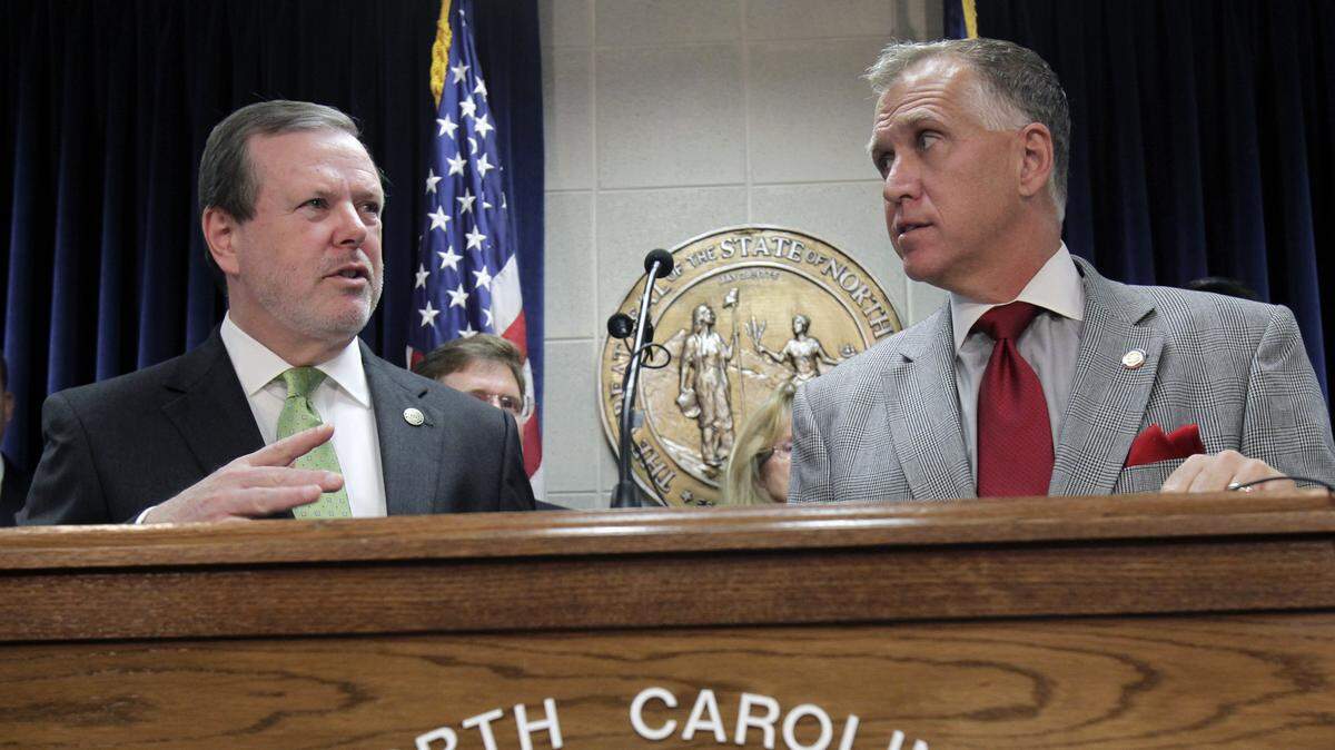 N.C. Senate leader Phil Berger, left, responds to a question while then-N.C. House Speaker Thom Tillis listens at a joint budget press conference held at the Legislative Building in Raleigh in June 2012.