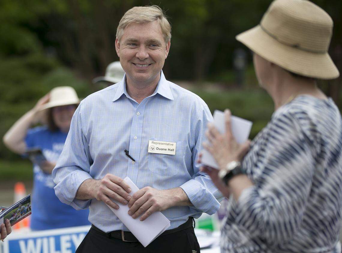 Rep. Duane Hall, who represents House District 11, works the poll at the Herbert C. Young Community Center on Wilkinson Ave. during early voting on Friday, April 27, 2018 in Cary, N.C.