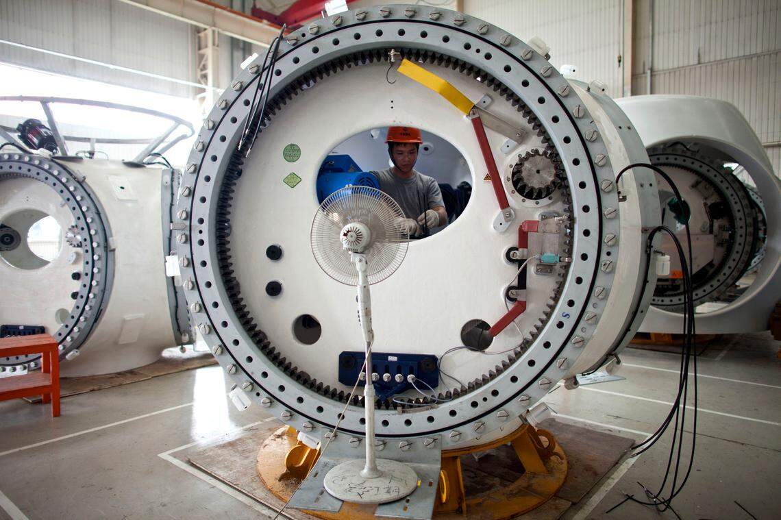 In this June 20, 2011, file photo, a worker assembles parts of a wind turbine at a factory in China. In the future, wind turbines may be built in the U.S.