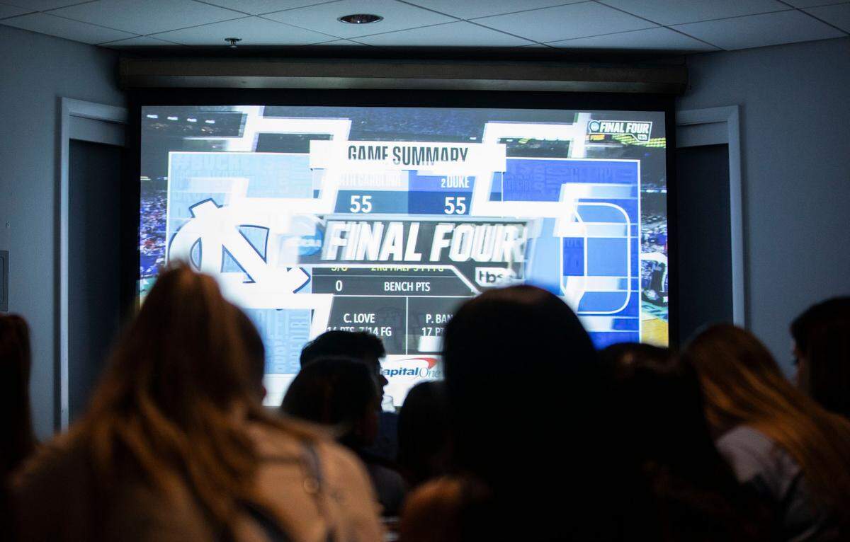In last minutes of a historic Final Four game between the UNC Tar Heels and the Duke Blue Devils there were several ties, as seen here on a screen at Top of the Hill in Chapel Hill, N.C. on Saturday, April 2, 2022.