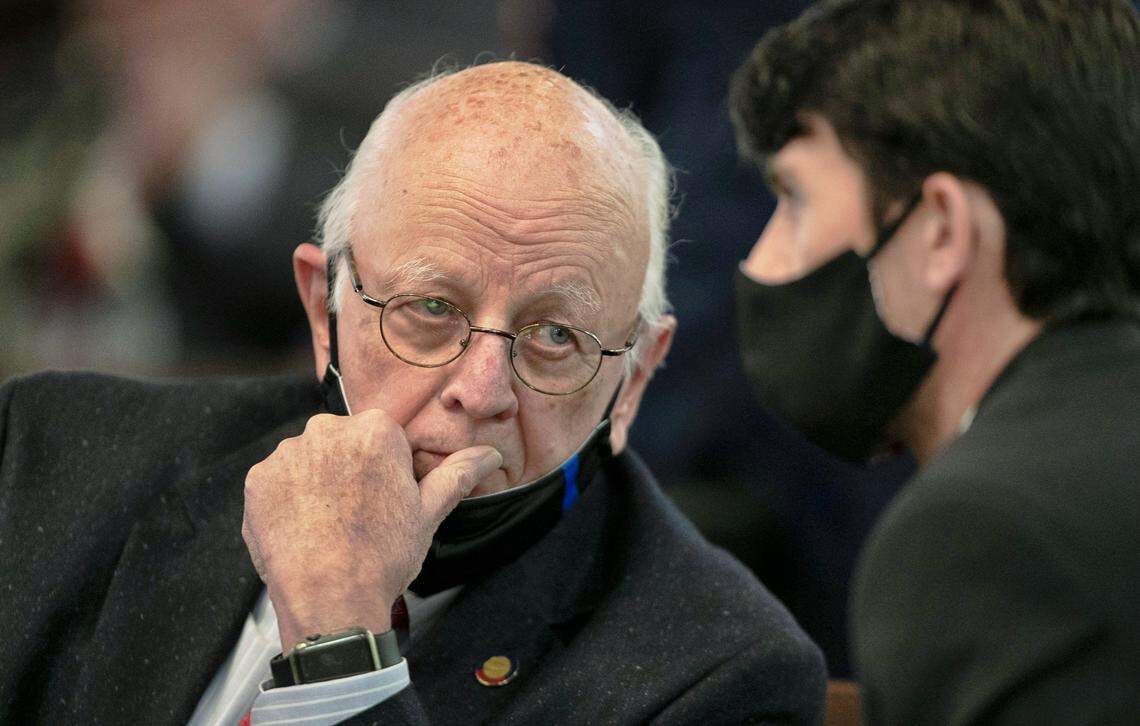 Rep. John Faircloth, left, of High Point talks with Rep. Jon Hardister of Whitsett, NC, during the brief House session on Wednesday, January 27, 2021 in Raleigh N.C. Both represent Guilford County in the General Assembly.