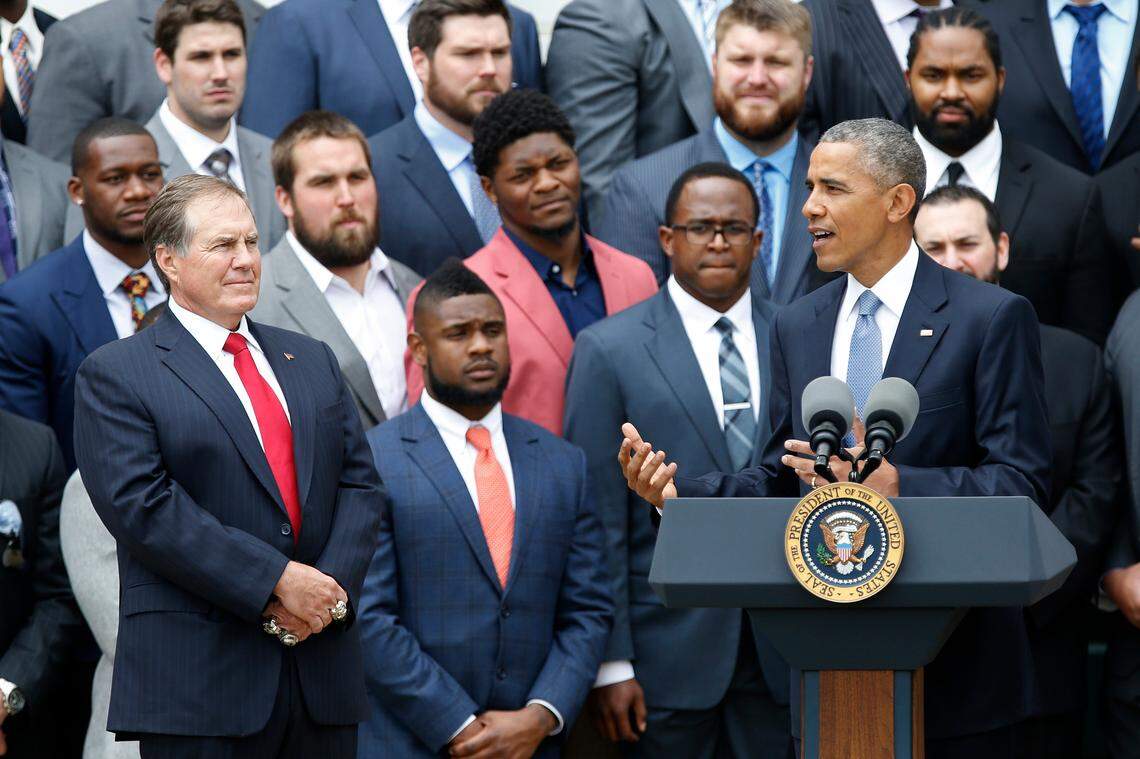 President Barack Obama speaks as New England Patriots head coach Bill Belichick and team members listen during a ceremony honoring the 2014 Super Bowl Champion New England Patriots on the South Lawn at the White House in April 2015.