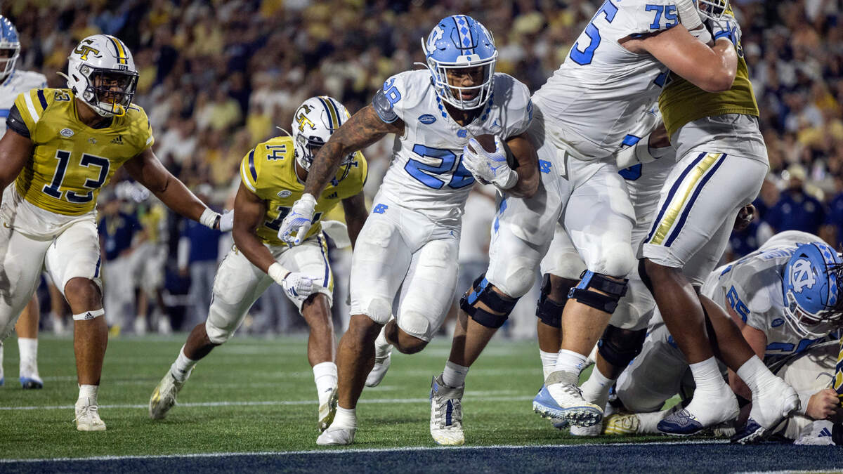 North Carolina’s Omarion Hampton (28) scores on a three-yard run to give the Tar Heels’ a 28-21 lead in the second quarter on Saturday, October 28, 2023 at Bobby Dodd Stadium in Atlanta, Georgia.