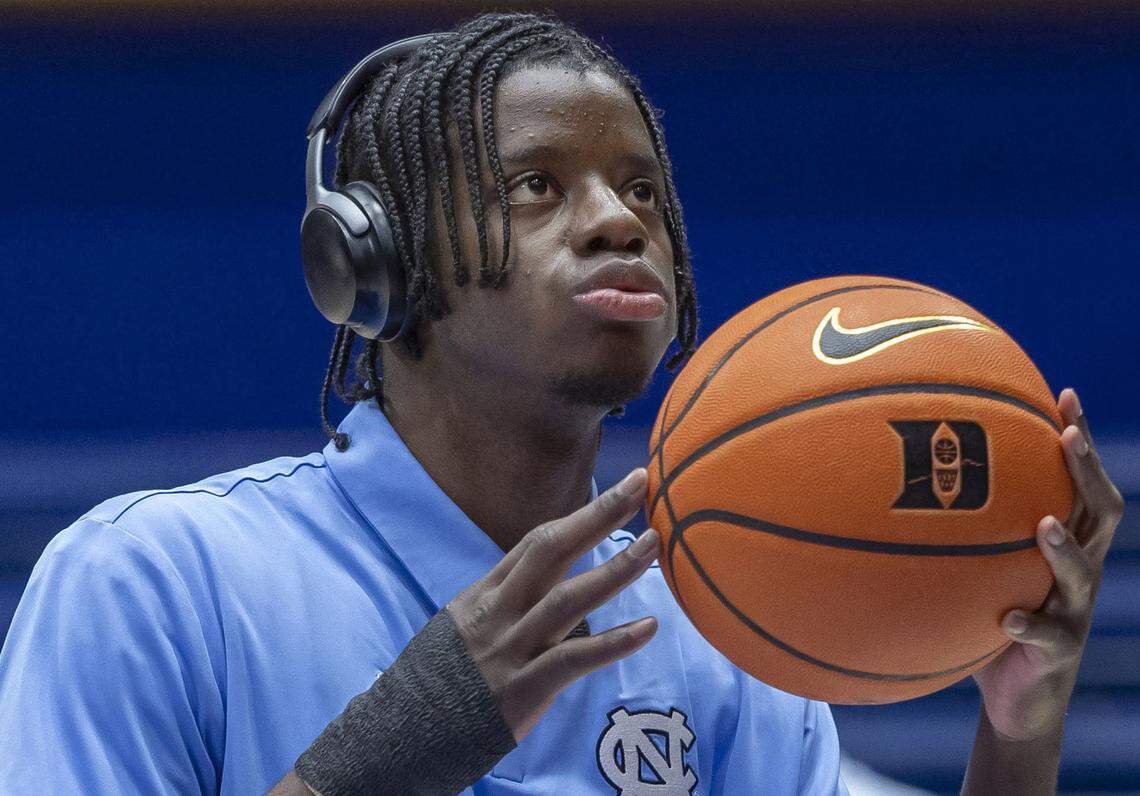 North Carolina forward Caleb Wilson (8), out with a broken thumb, handles the ball, as his teammates warm up for the Tar Heels’ game against Duke on Saturday, March 7, 2026 at Cameron indoor Indoor Stadium in Durham, N.C.