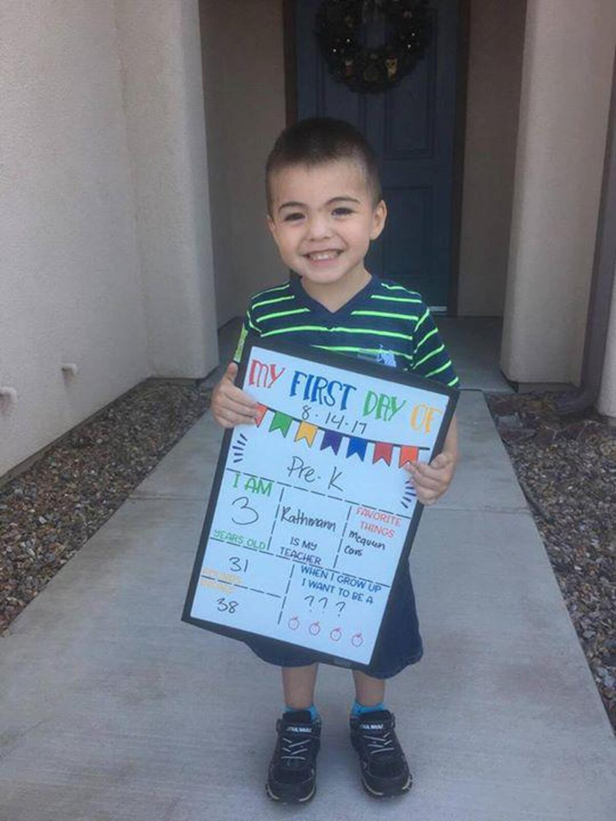 Three-year-old Michael Rivera holds up a sign celebrating his first day of pre-K in Arizona on Aug. 14, 2017. The Rivera family moved to North Carolina the next month, and Michael died in November. His sister Olivia, 2, died two months later from similar injuries.