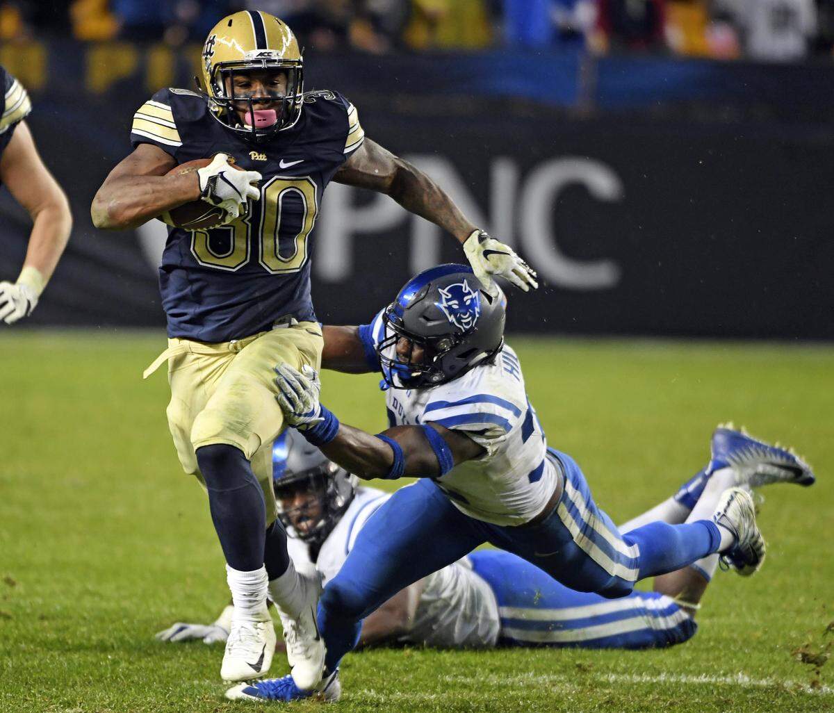 Pittsburgh’s Qudree Ollison avoids Duke’s Brandon Hill in the fourth quarter of an NCAA college football game, Saturday, Oct. 27, 2018, in Pittsburgh. Pitt won 54-45. 