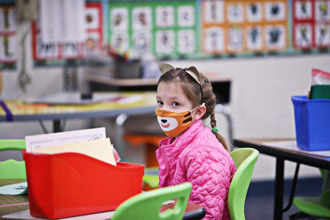 Cleary Brewer and other first grade classmates work from spaced tables in their Hunter Elementary School classroom in Raleigh on Monday, October 26, 2020, on the first day back in school for some Wake students.