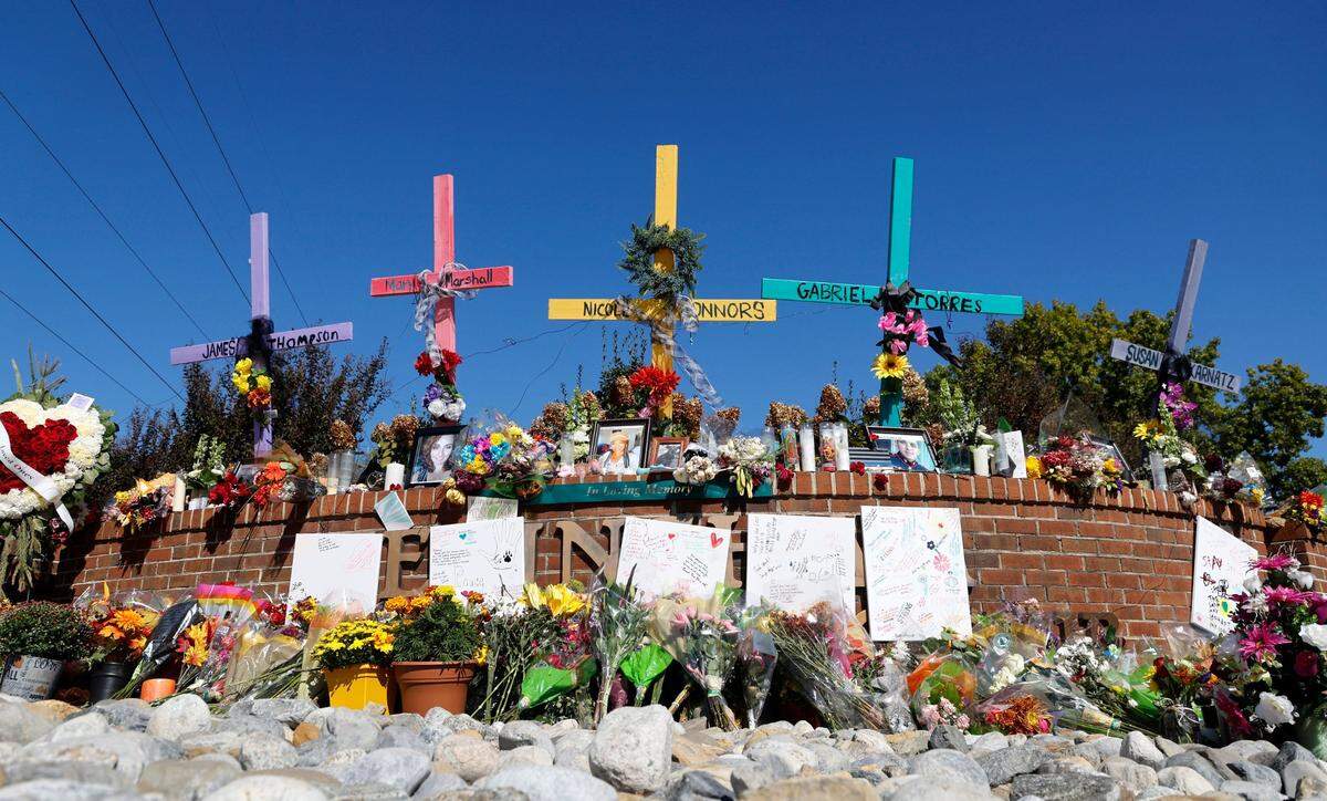 A memorial for those killed in a mass shooting in the Hedingham neighborhood is seen outside the Hedingham Golf & Athletic Club in Raleigh, N.C. Wednesday, Oct. 19, 2022.