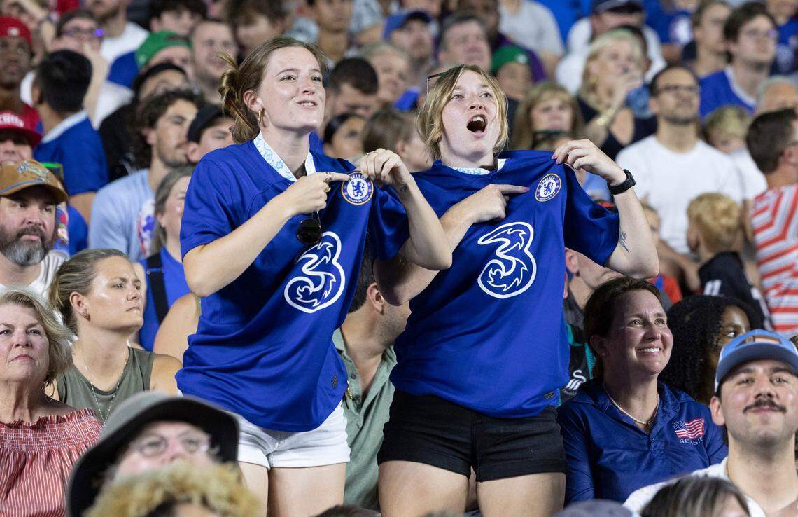 Sarah Stephen, left, from Charlotte, and Jordynne Godsey of McDonough, Georgia celebrate after Chelsea scored during the first half of Chelsea Football Club’s friendly match against Wrexham F.C. at Kenan Stadium in Chapel Hill, N.C., Wednesday, July 19, 2023. The two came just to see the game.