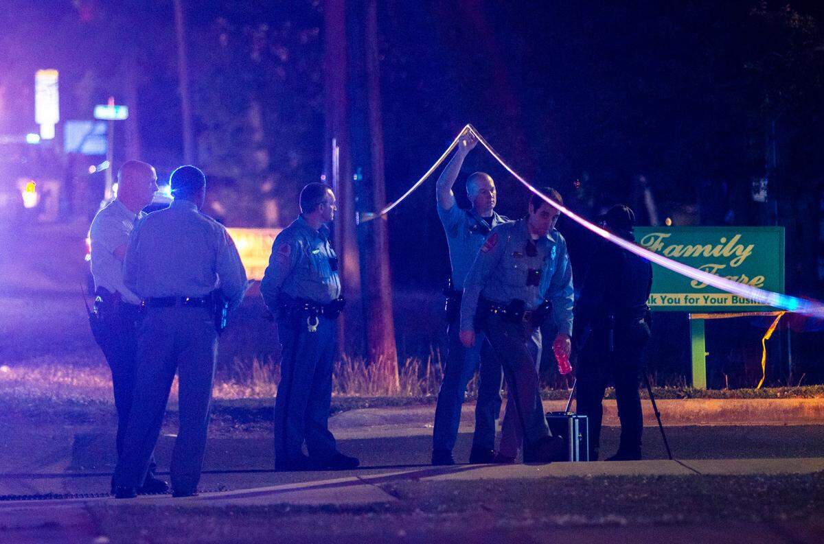 Police work the scene of and armed robbery and gunfire exchange between a police officer and a suspect at a Family Fare BP gas station at 2120 New Bern Avenue in Raleigh Wednesday, April 13, 2020.