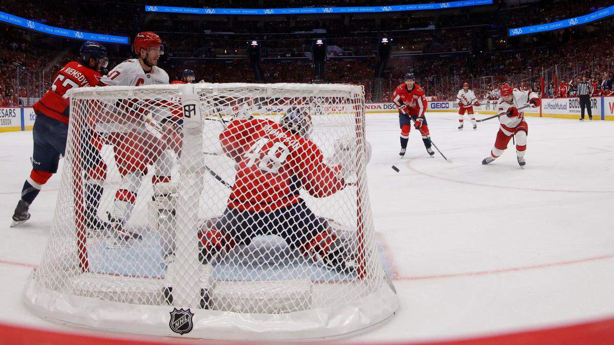 May 8, 2025; Washington, District of Columbia, USA; Washington Capitals goaltender Logan Thompson (48) makes a save on Carolina Hurricanes defenseman Sean Walker (26) in the third period in game two of the second round of the 2025 Stanley Cup Playoffs at Capital One Arena. Mandatory Credit: Geoff Burke-Imagn Images