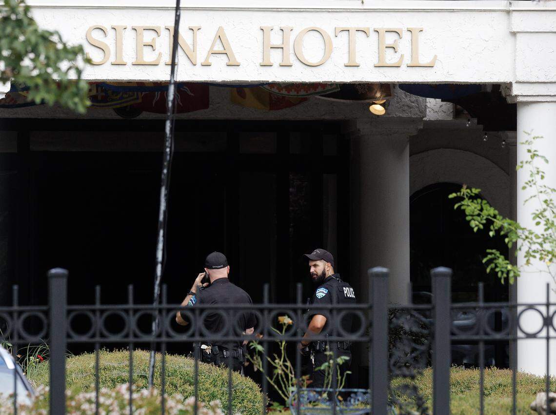Law enforcement are stationed outside the Siena Hotel on East Franklin Street in Chapel Hill, N.C., Friday morning, August 22, 2025.
