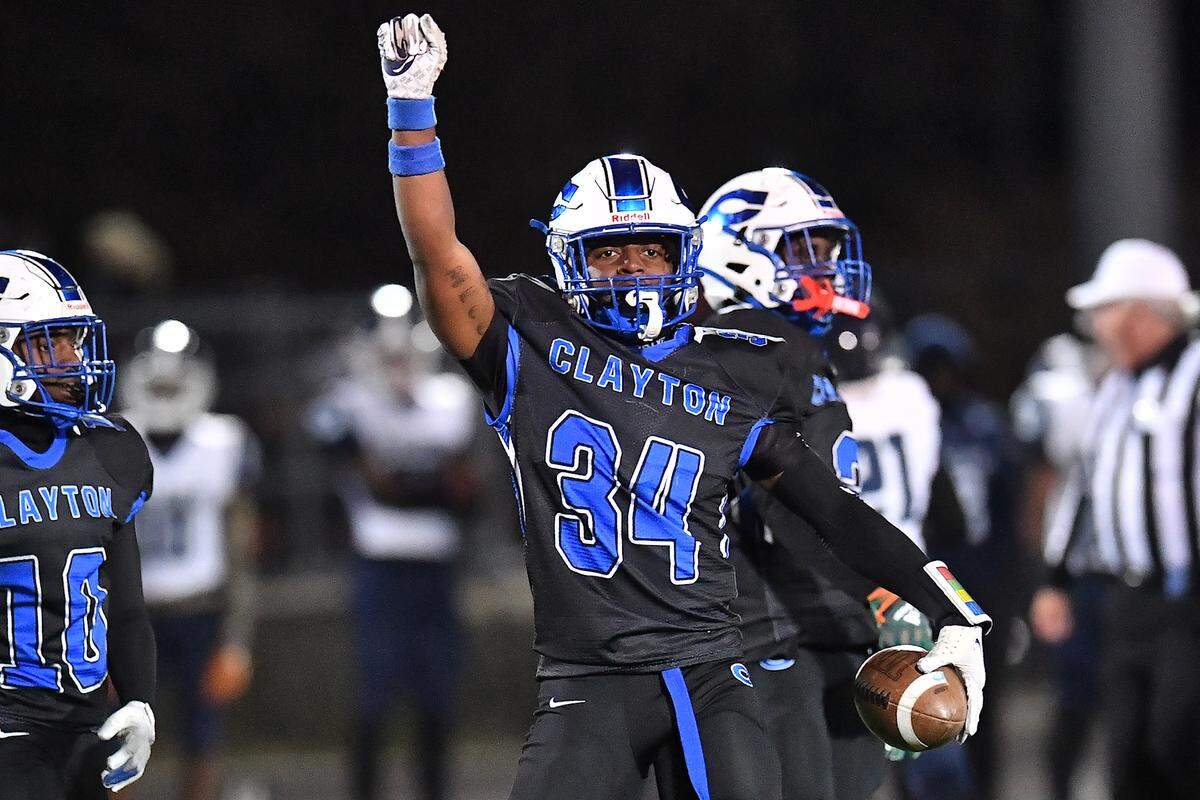 Clayton linebacker Imari Givens (34) reacts after the turnover on downs by Southeast Raleigh during the second half. The Clayton Comets and the Southeast Raleigh Bulldogs met in the fourth round of the NCHSAA 7A Playoffs in Clayton, N.C. on November 28, 2025.